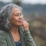 older woman with slight smile understanding what anxiety means