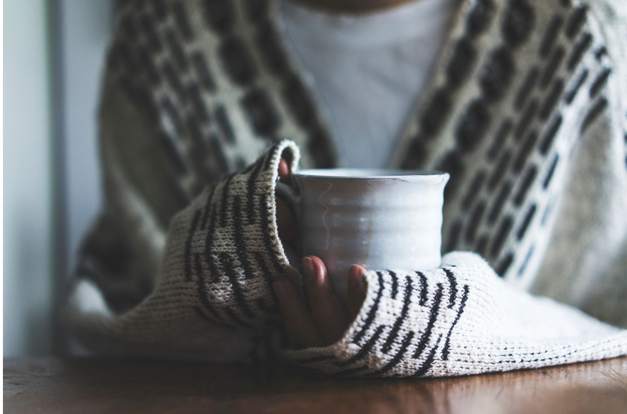 woman with hangover anxiety holding cup after drinking alcohol