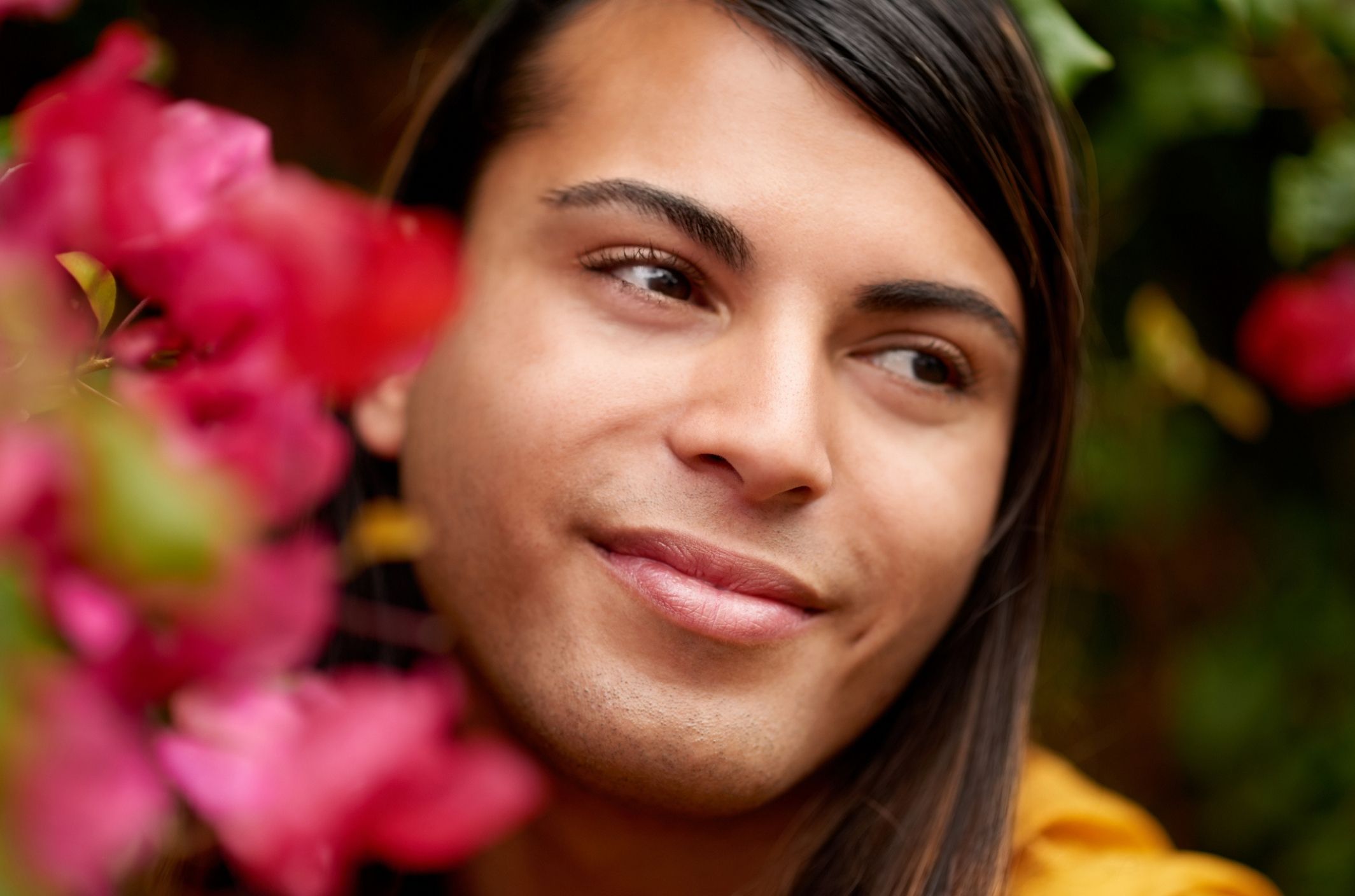 young transgender woman with dysthymia persistent depressive disorder slight smile bougainvillea (3)