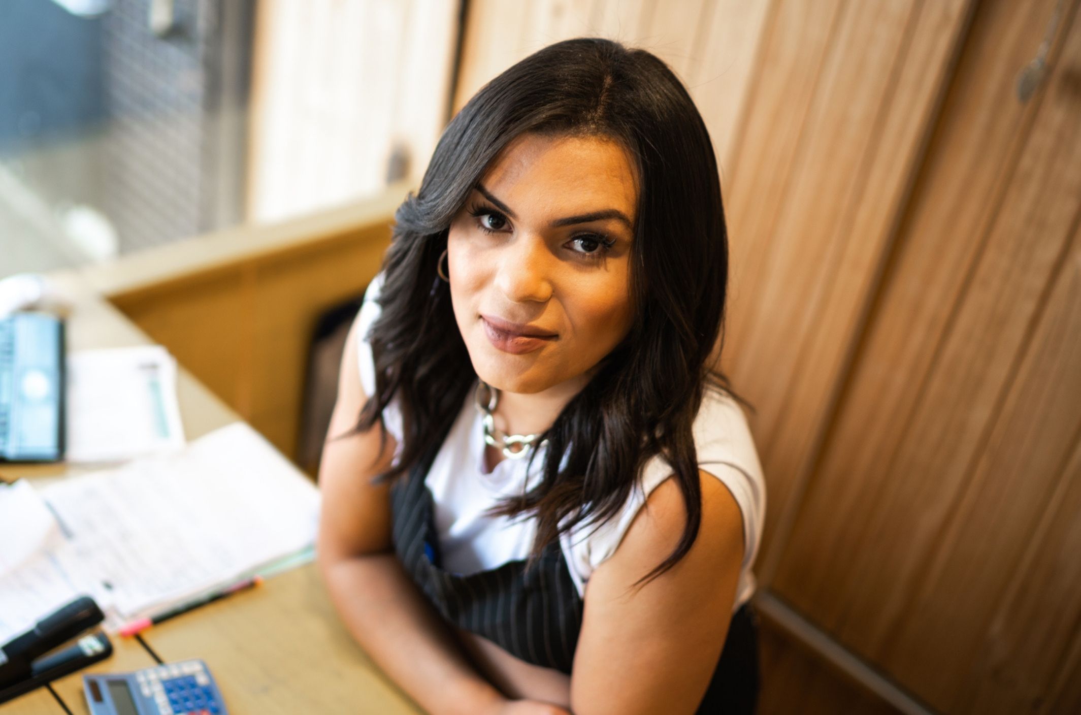 young non-binary woman at work managing anxiety triggers