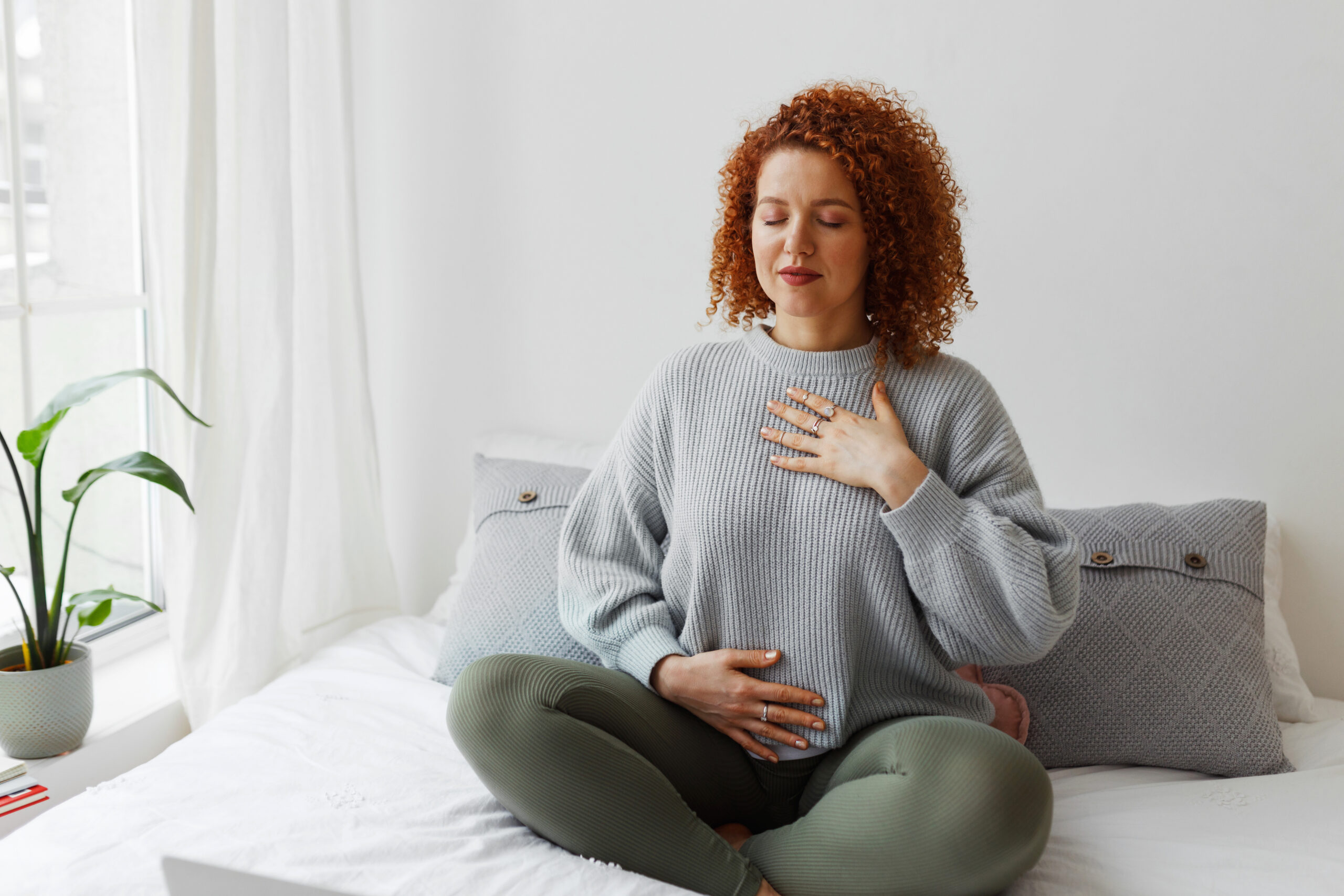 Plus-size woman practicing mindful breathing to manage anxiety and break the cycle of overeating