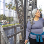 A woman drinking water after exercise, symbolizing the role of physical activity in supporting a medical weight loss plan for overall health and well-being.