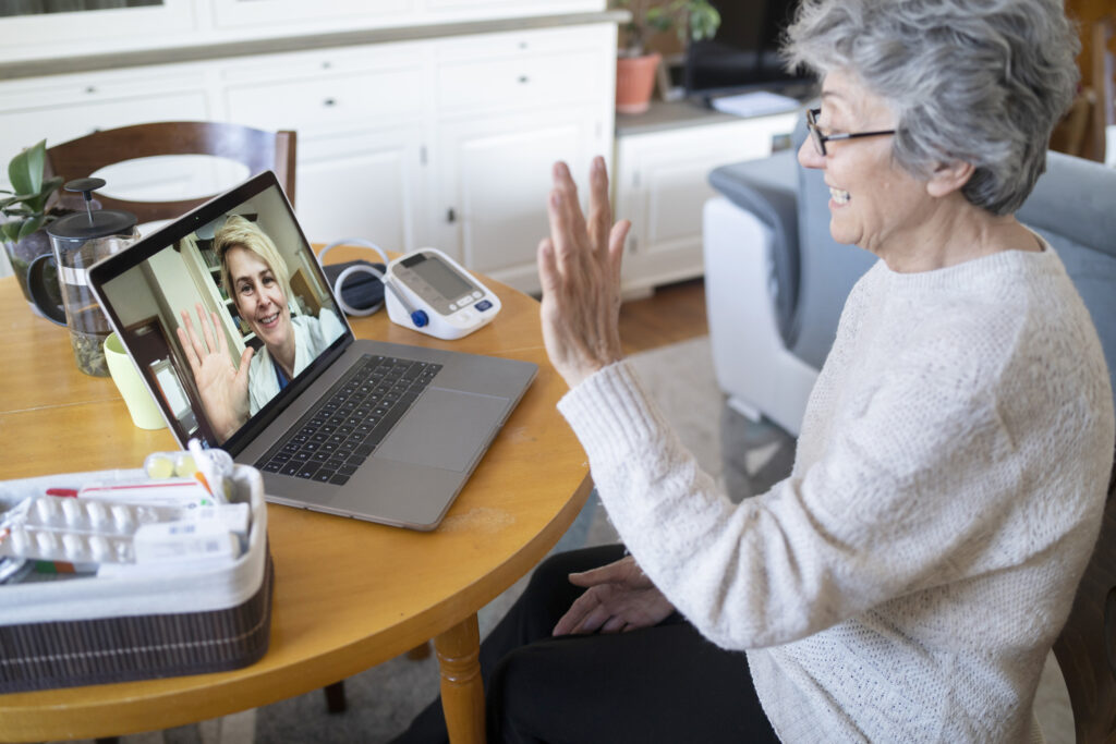 Doctor conducting an online consultation, symbolizing the importance of seeking professional help for high blood pressure and monitoring symptoms.